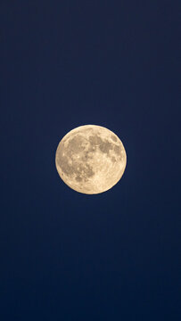 Full moon over the serene night sky in the French Alps