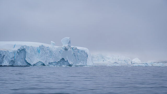 Majestic icebergs in the cold waters of Greenland - Powered by Adobe
