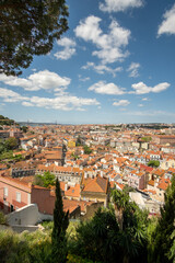 Fototapeta premium Framed view down at the red tile roofs of Lisbon, Portugal