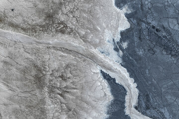 Aerial view of saline mud textures with abstract patterns