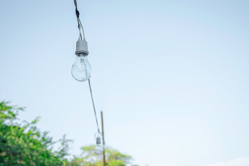 Light bulb decorate on outdoor with blue sky background