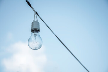 Light bulb decorate on outdoor with blue sky background
