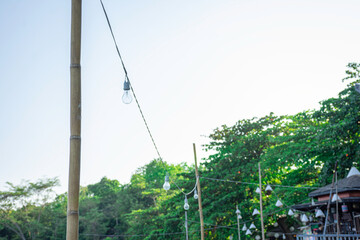 Light bulb decorate on outdoor with blue sky background