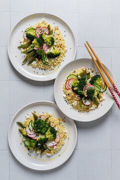 Broccoli and couscous salad with vegetables and seeds