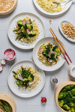 Top view of couscous salad with broccoli and radish