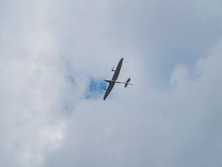 White military UAV in flight against cloudy sky during tactical reconnaissance mission demonstration