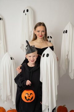 Portrait of a woman and boy celebrating Halloween