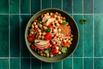 Fresh chickpea salad with cherry tomatoes and apples