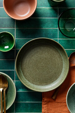 Elegant table setting with ceramic dishes and cutlery