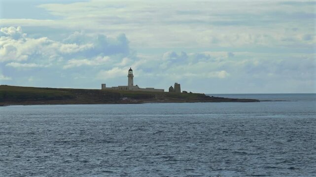 A lighthouse on the coast of the Orkney Islands, Scotland, UK