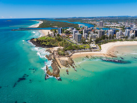 Aerial views of the Coolangatta coastline and skyline with Snapper Rocks and Rainbow Bay in the foreground and Fingal Head in the background
