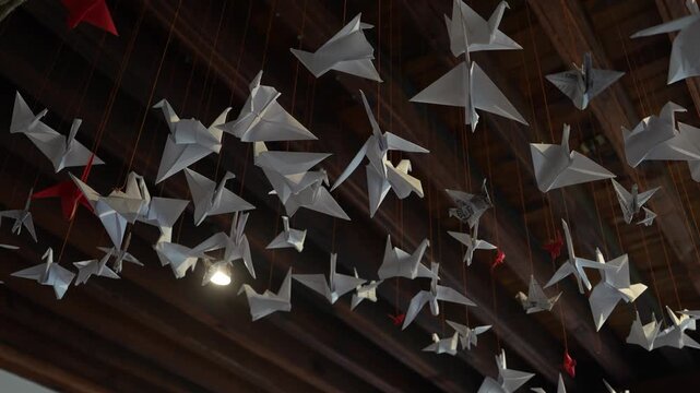 Origami birds pending from ceiling