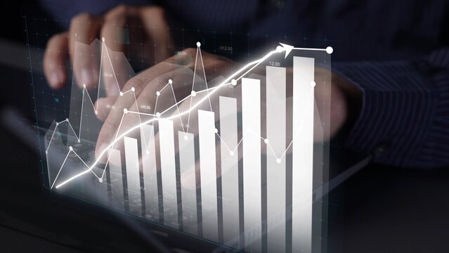 Business professional analyzing financial data trends using digital graphs and charts on a laptop. Emphasizes investment analysis and strategic growth. Copula