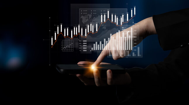 A close-up view of a hand interacting with a smartphone, displaying financial charts and graphs that reflect stock market trends and data analysis, ideal for business and technology imagery. Scalp