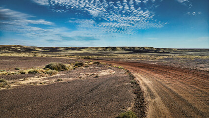 Scenic Desert Landscape with cloudy Blue Sky and Road to Lake Eyre