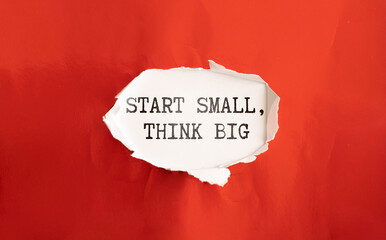 Wooden blocks with words 'START SMALL THINK BIG'.