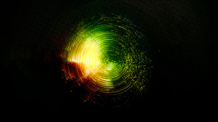 Vibrant green, yellow, and red colors in circular motion on black.