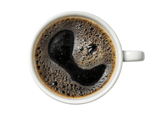 Coffee-filled cup, dark brew with foam, overhead view
