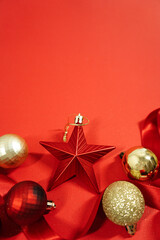 Christmas Ornaments and Ribbon on Red Background