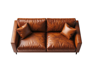 Tan leather couch with pillows on black background