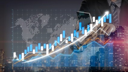 Businessman in a modern office analyzes market trends using a smartphone with detailed graphs and data visualization, showcasing success in finance and investment. Copula