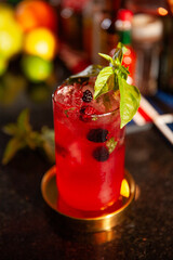 red cocktail with berries