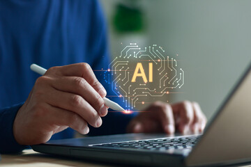Close up of hand using stylus pen on laptop with AI technology graphic, representing artificial intelligence, innovation, data analysis and digital transformation in modern technology.