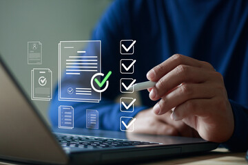 Close up of hand using stylus pen on laptop with digital checklist and document icons, symbolizing task management, online form approval, productivity, business planning and workflow organization.