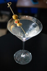 martini glass with olives