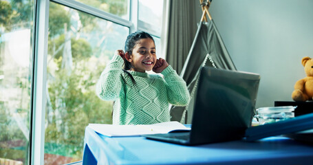 Girl, child and happy with laptop for homeschool, online course and elearning with development in house. Kid, education and smile for video call, books or virtual class with attention at apartment