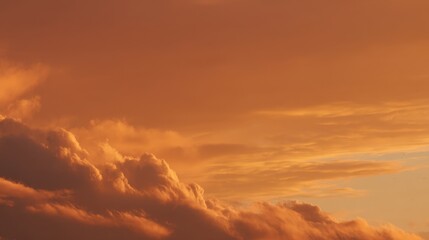 Fototapeta premium Serene Sunset Sky with Colorful Clouds Illuminated by Warm Golden Hues Reflecting on the Tranquil Evening Atmosphere Above the Horizon
