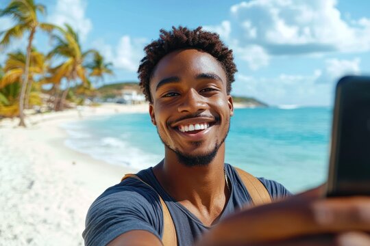 Smiling young man taking a selfie on a sunny tropical beach with palm trees and bright blue ocean under a partly cloudy sky