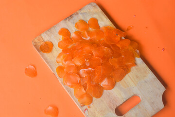 Crackers, cuanki, noodles, and complete dry seblak seasoning on a wooden tray