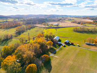 A farm and farmhouse during sunset. Aerial drone. 