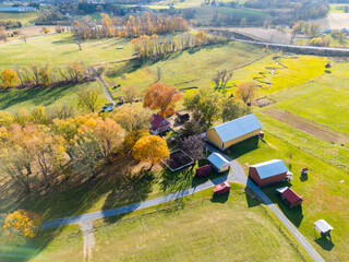 A farm and farmhouse during sunset. Aerial drone. 