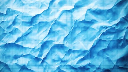 Fototapeta premium Close-up of crumpled light blue graph paper with visible grid lines and varied shadows creating textured patterns