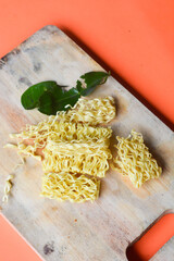 Indonesian-style dry noodles served without broth, typically stir-fried or boiled then mixed with soy sauce, oil, and seasonings. Often topped with fried shallots, green vegetables, and pieces of chic