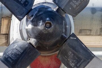 Close-up of aged propeller hub and blades on retired turboprop aircraft preserved as monument