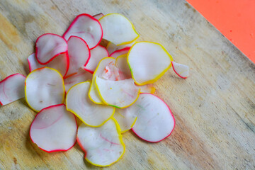 Crackers, cuanki, noodles, and complete dry seblak seasoning on a wooden tray