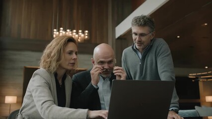 Medium shot showing a creative team brainstorming dynamic QR code designs for seamless integration between print materials and engaging augmented reality features - Powered by Adobe