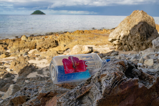 Discarded Fiji Water Bottle Washed Up on a Tropical Island Beach on March 20, 2025 in Nadi, Fiji 