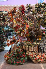 christmas trees and decorations in a market
