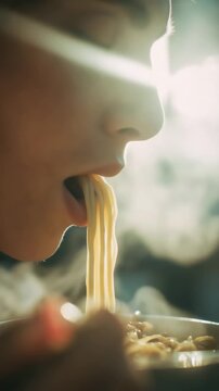 Close-up photo of lips slurping noodles 