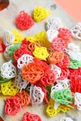 Crackers, cuanki, noodles, and complete dry seblak seasoning on a wooden tray