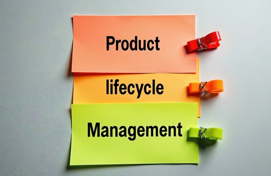 Colored sticky notes spell Product Lifecycle Management concept. Orange, yellow, green paper with bold words, bright clips on white background. Visual helps explain business strategy, product