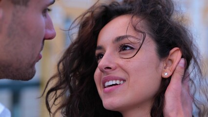 Close up shot of happy young couple gentle man and beautiful woman looking at each other in the eyes. Love relations. Boyfriend and girlfriend. Husband gently holding his wife