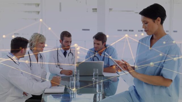 Medical team reviewing laptop right nurse tapping tablet causing animated moving nodes for review