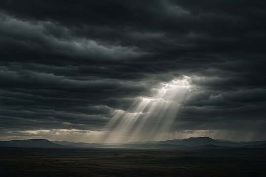 Brooding storm sky with heavy charcoal clouds rolling across expansive dramatic horizon