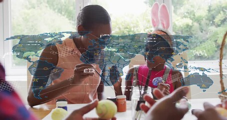 Mom guiding girl painting eggs at table, hands passing eggs and brush, tech map overlay growing - Powered by Adobe
