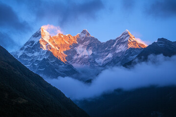 breathtaking mountain range as morning mist catches the first rays of sunlight
